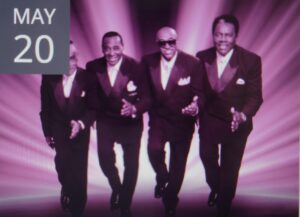 the drifters band members with purple background